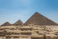 The Giza pyramid complex, an archaeological site on the Giza Plateau, on the outskirts of Cairo, Egypt. It includes the three Royalty Free Stock Photo