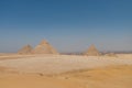 The Giza pyramid complex, an archaeological site on the Giza Plateau, on the outskirts of Cairo, Egypt. It includes the three Royalty Free Stock Photo