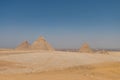 The Giza pyramid complex, an archaeological site on the Giza Plateau, on the outskirts of Cairo, Egypt. It includes the three Royalty Free Stock Photo