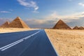 Giza Pyramids and a road in the desert, Egypt, no people Royalty Free Stock Photo