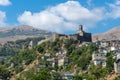 Gjirokastra cityscape in Southern Albania. Old town and Gjirokaster old castle top view. Popular Albanian travel destination Royalty Free Stock Photo