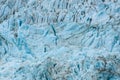 Glacial blues and dirt browns in fractured ice patterns on glacier in Drygalski Fjord, South Georgia, as a nature background