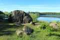 Glacial erratic boulders over the lake