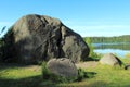 Glacial erratic boulders over the lake Royalty Free Stock Photo