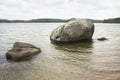 Glacial erratic on shore of Cliff Pond at Cape Cod Royalty Free Stock Photo