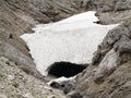 Ice cave in rock crevice mountainous region