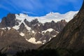 A hanging Glacier, peeking out over the forest, at the top of one of the mountains of the French Valley in Torres Del Paine Natio Royalty Free Stock Photo