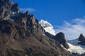 A hanging Glacier, peeking out over the forest, at the top of one of the mountains of the French Valley in Torres Del Paine Natio Royalty Free Stock Photo