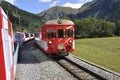 The glacier Express train is driving across the swiss alps and t