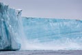 A Glacier, Carving, With Floating Sea Ice North Of Svalbard In The Arctic, With Water Falls