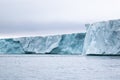 A Glacier With Floating Sea Ice North Of Svalbard In The Arctic, With Water Falls
