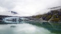 Glacier and mountain with clouds panorama, Alaska. Royalty Free Stock Photo