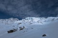 Glacier seracs crevasses illuminated by sun in snowy winter land