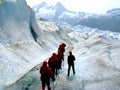 Glacier trekkers along stream Royalty Free Stock Photo