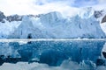 Shelf ice, glacier wall in Antarctica, majestic blue and white glacier edge reflecting in blue sea water, Paradise Bay, Antarctica