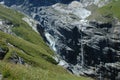 Glacier and waterfall in valley nearby Grindelwald in Alps.