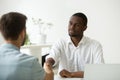 Glad African American employer handshaking hired Caucasian job a Royalty Free Stock Photo