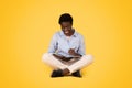 Glad black woman student, make notes at notebook, make homework, sit on floor