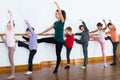 Glad boys and girls rehearsing ballet dance in studio Royalty Free Stock Photo