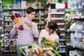 Female shopper with teenage daughter searching for pasta Royalty Free Stock Photo