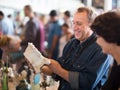 Glad family study the range of flea market Royalty Free Stock Photo