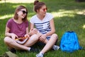 Glad happy female youngsters look positively aside, have charming smiles as notice handsome guy into distance, spend free time on