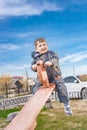 ÃÂ glad little boy on a teetertotter