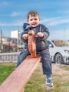 ÃÂ glad little boy on a teetertotter