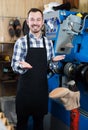 Glad man worker displaying his workplace Royalty Free Stock Photo