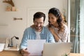 Glad married couple impressed with perfect news received by mail