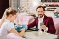 Glad mature man visiting nails bar