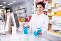 Pharmacist ready to assist in choosing at counter