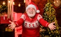 Glad see you. Celebrate new year. Stylish elderly man. Christmas traditions. Stick to traditions. Knitted sweater. Santa