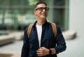 Glad shocked young european man student in glasses with backpack enjoy lifestyle, look at free space