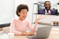 Glad surprised millennial african american business lady has video call