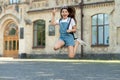 glad teen kid jump. energetic teen girl jump outdoor. free teen child jump