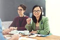 Glad to be working alongside the best in the business. Portrait of a young businesswoman sitting in a meeting with her Royalty Free Stock Photo