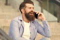 Glad to hear you again. Mobile communication. Mobile conversation. Man with smartphone urban background. Handsome man Royalty Free Stock Photo