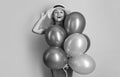 glad woman with balloons at summer birthday in studio. woman with balloons at summer birthday