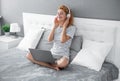 glad woman listen music in headphones. woman listen music at home wearing headphones.