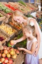 Mother with daughter shopping fruits Royalty Free Stock Photo