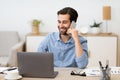 Gladful Man Talking On Phone Working Sitting In Office