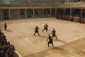 gladiators of different schools, fighting in the chariot arena