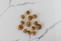 Gladiolus bulbs, corms or seeds on a white background