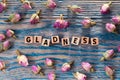 Gladness on wooden cube