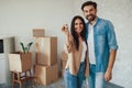 Cheerful lady and her male partner feeling happy about new home Royalty Free Stock Photo