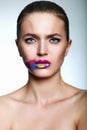 Glamor closeup portrait of beautiful stylish young woman model with bright makeup, with creative colorful bright lips with p Royalty Free Stock Photo