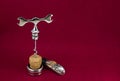 Glamor corkscrew with a cork on a red burgundy background