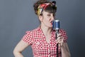 Glamor female rocker and vocal artist with retro style singing Royalty Free Stock Photo