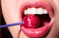 Glamor mouth licking yummy lollypop with red lips. Sucks lolli pop. Sexy female lip. Sensual woman red lips with a Royalty Free Stock Photo